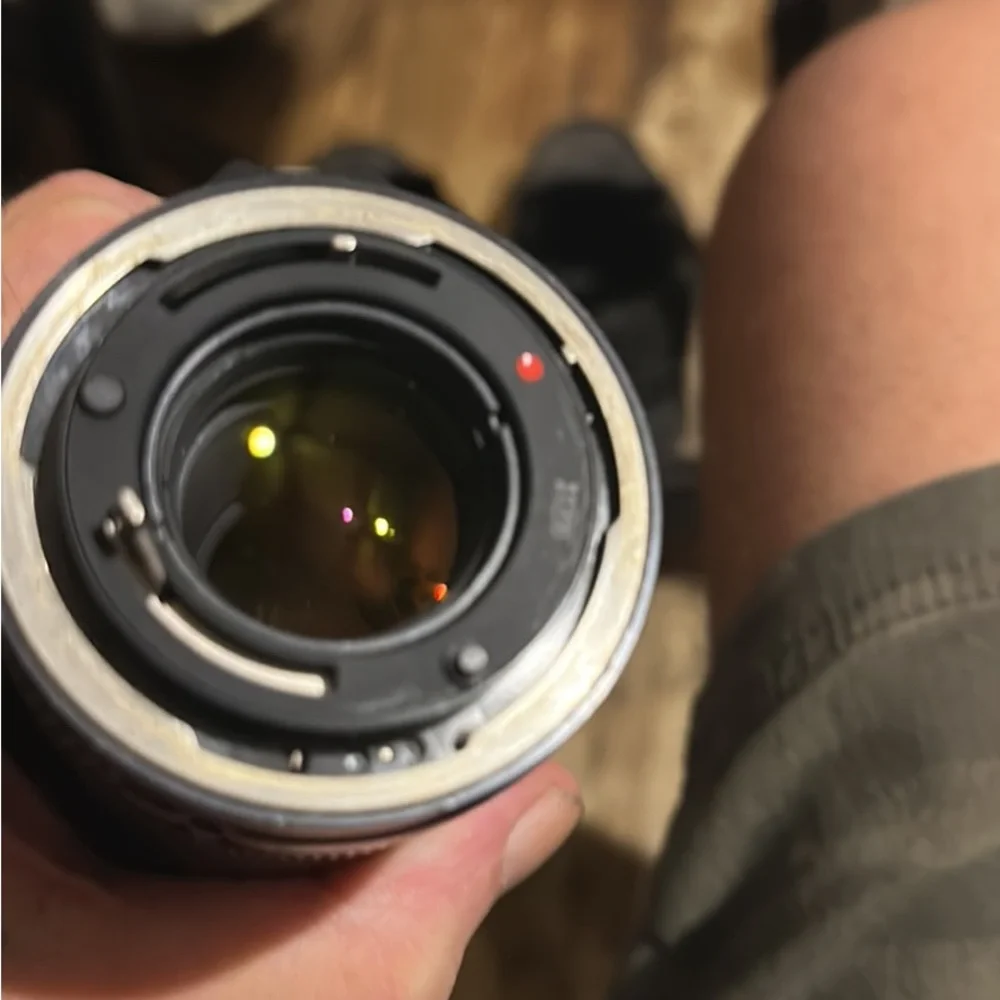 Two lenses one made by canon one made by prinz in box